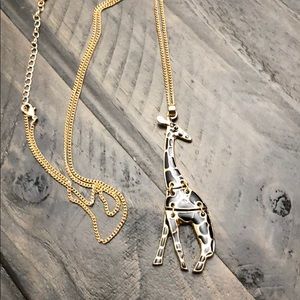 Giraffe Pendant on a gold necklace